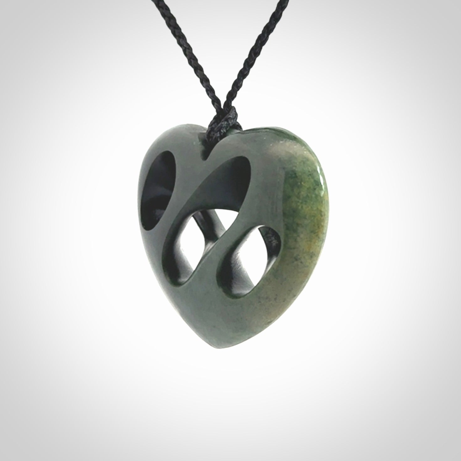 Hand carved New Zealand jade, complex twist heart pendant.