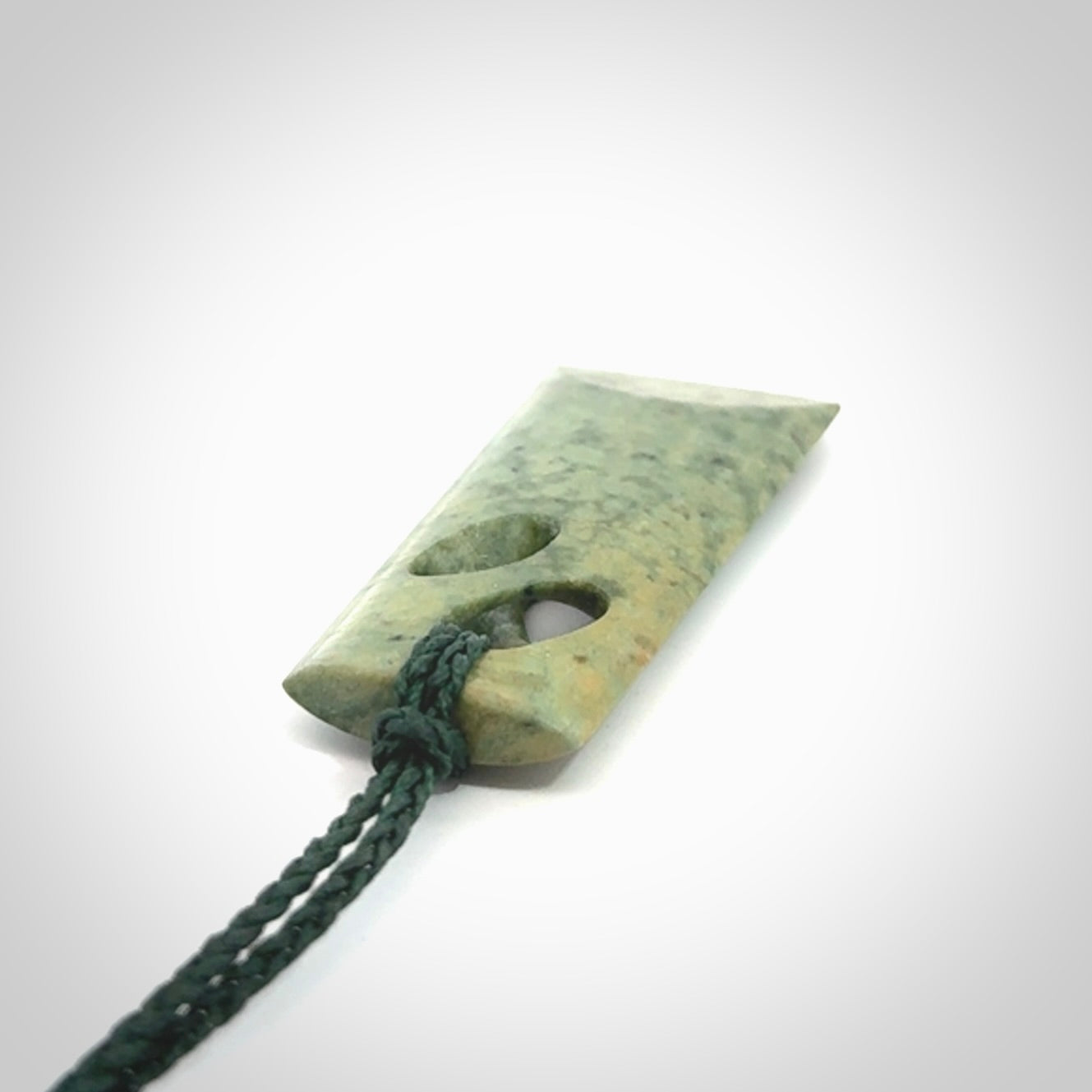 Hand carved New Zealand jade, complex twist pendant. Hand made complex twist pendant hand carved in New Zealand.