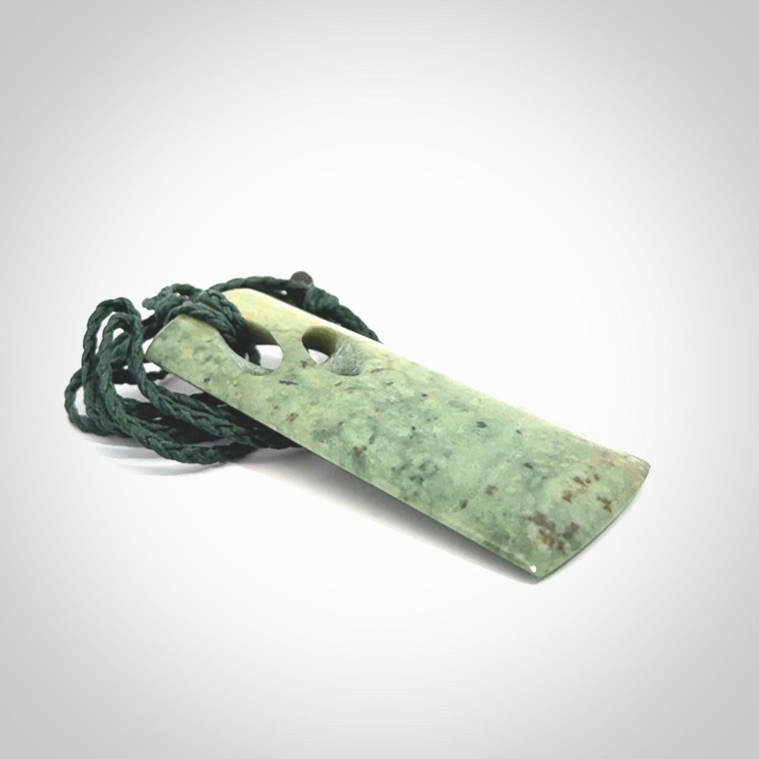 Hand carved New Zealand jade, complex twist pendant. Hand made complex twist pendant hand carved in New Zealand.