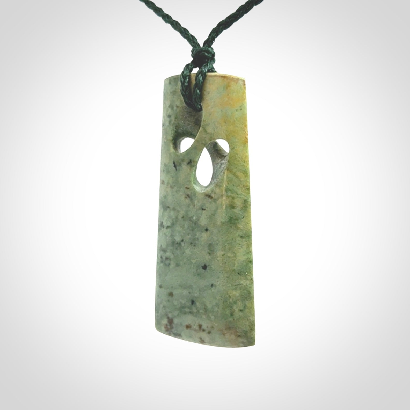 Hand carved New Zealand jade, complex twist pendant. Hand made complex twist pendant hand carved in New Zealand.