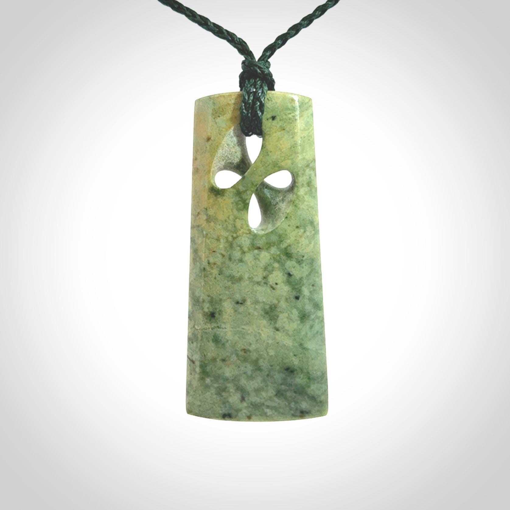 Hand carved New Zealand jade, complex twist pendant. Hand made complex twist pendant hand carved in New Zealand.