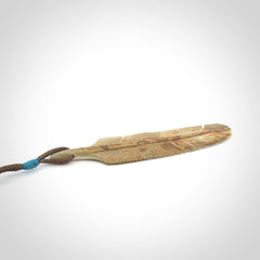 This photo shows a finely carved feather pendant for all you bird lovers and aficionados of the art of flight. It is hand carved by us from rare woolly mammoth tusk.