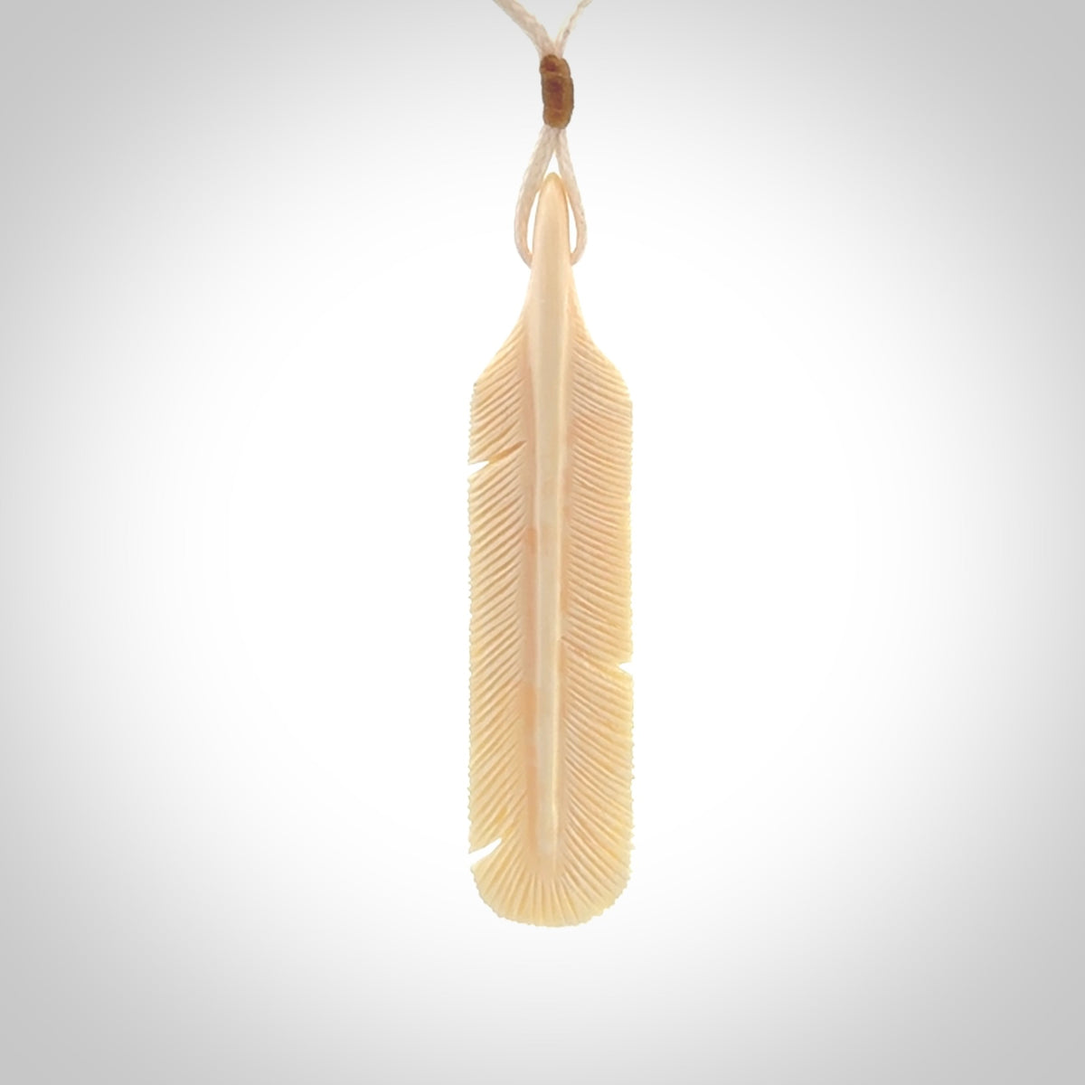 Hand carved Woolly Mammoth Tusk feather pendant. Art to Wear. Provided with adjustable cord.