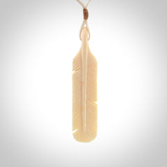 Hand carved Woolly Mammoth Tusk feather pendant. Art to Wear. Provided with adjustable cord.