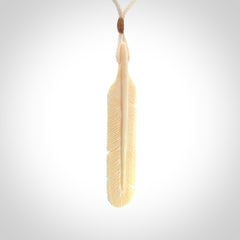 Hand carved Woolly Mammoth Tusk feather pendant. Art to Wear. Provided with adjustable cord.