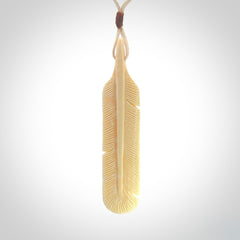 Hand carved Woolly Mammoth Tusk feather pendant. Art to Wear. Provided with adjustable cord.