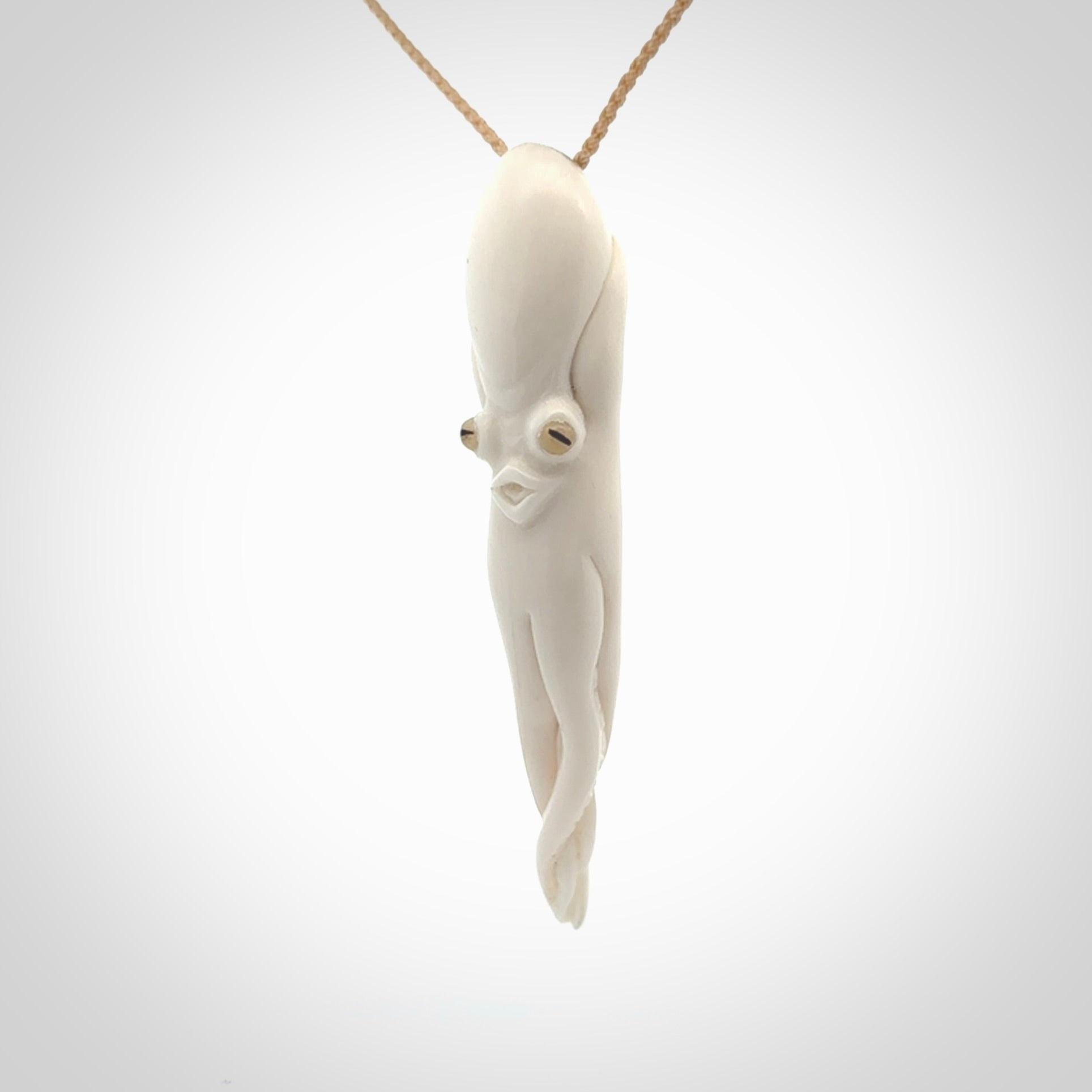 Hand carved octopus pendant in resting pose. This piece has been carved in incredible detail from bone. The artist is Fumio Noguchi, a renowned New Zealand bone carver who carves pieces for NZ Pacific. These unique bone pendants are for sale online at nzpacific.com One only collectors item for lovers of the ocean and octopus.