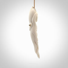 Hand carved octopus pendant in resting pose. This piece has been carved in incredible detail from bone. The artist is Fumio Noguchi, a renowned New Zealand bone carver who carves pieces for NZ Pacific. These unique bone pendants are for sale online at nzpacific.com One only collectors item for lovers of the ocean and octopus.