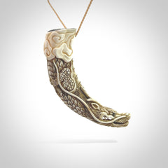 Hand carved dragon Pendant. Made from warthog tusk in New Zealand. Unique dragon necklace hand made from warthog tusk by master bone carver Fumio Noguchi. Spectacular collectable work of art, made to wear. One only pendant, delivered to you at no extra cost with express courier.
