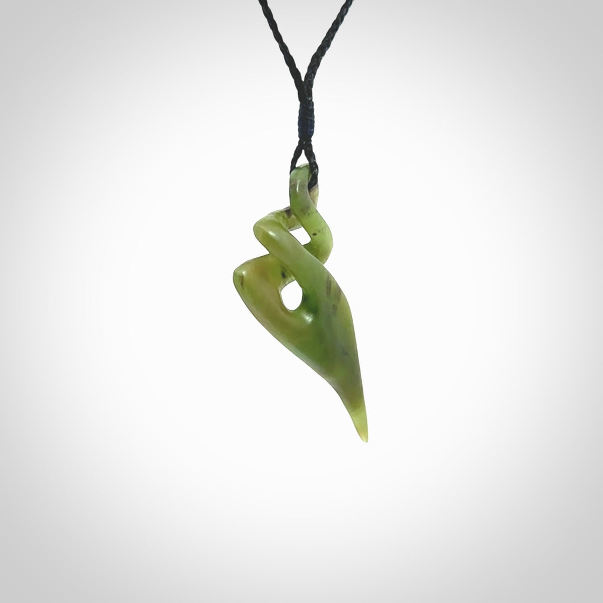 Hand carved large New Zealand jade twist pendant. Carved in New Zealand by NZ Pacific. Hand made Jade twist with adjustable black cord by Shaun Gardiner.