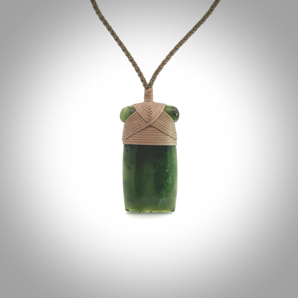 Hand carved jade toki pendant. Carved by NZ Pacific in green jade. Hand made Jade Toki necklace for men and women. Beautiful greenstone Toki with adjustable cord. Delivered to you with Express Courier.