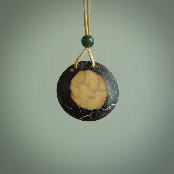 This is a hand carved elephant pendant. It is made from Tigara nut. This is a small sized necklace and is a very unique, one only, pendant that is a collectors piece. Hand carved by New Zealand artist, Sami.