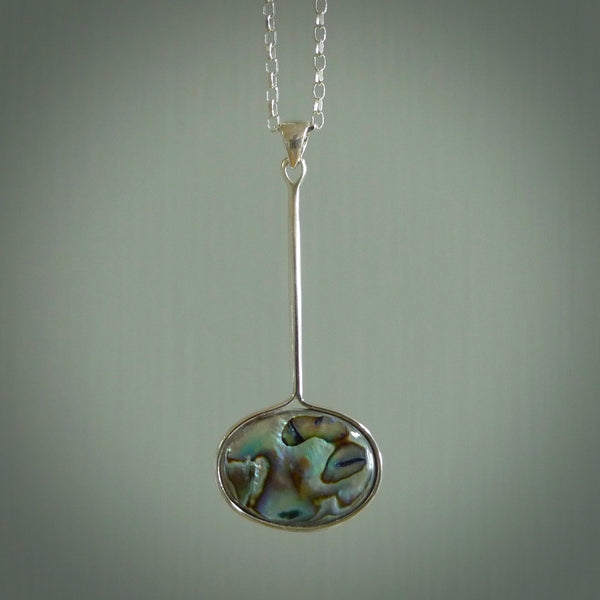 Hand made pendant with one side carved from Woolly mammoth tusk and the other from our local cold water pāua shell. This is a custom design by us and only available fro NZ Pacific.