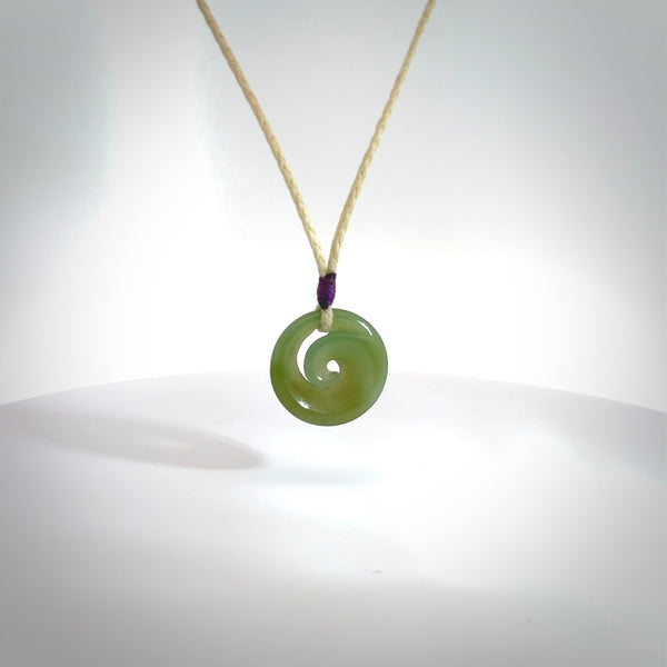 This little pendant is a beautifully carved, small jade koru pendant. Hand Carved for NZ Pacific by Graeme Wylie. Jade jewelry for sale online exclusively with NZ Pacific.