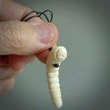 Hand carved huhu bug  pendant, carved for us by Fumio Noguchi. This piece is carved from bone and is a fantastic depiction of these bugs. This particular piece is a huhuh bug design and is lovingly carved. Free shipping worldwide.