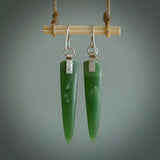 These are stunning large wing shaped drop jade earrings carved in New Zealand by Josey Coyle. It is carved from a deep green piece of New Zealand Jade and with Sterling Silver hooks and findings.
