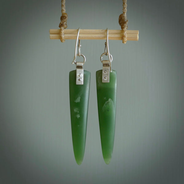 These are stunning large wing shaped drop jade earrings carved in New Zealand by Josey Coyle. It is carved from a deep green piece of New Zealand Jade and with Sterling Silver hooks and findings.