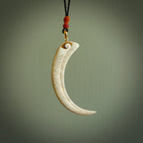 This is a hand carved whale bone huia bird beak pendant. It is made from whale bone with jade bead. This is a large sized necklace and is a very unique, one only, pendant that is a collectors piece. Hand carved by New Zealand artist, Sami.