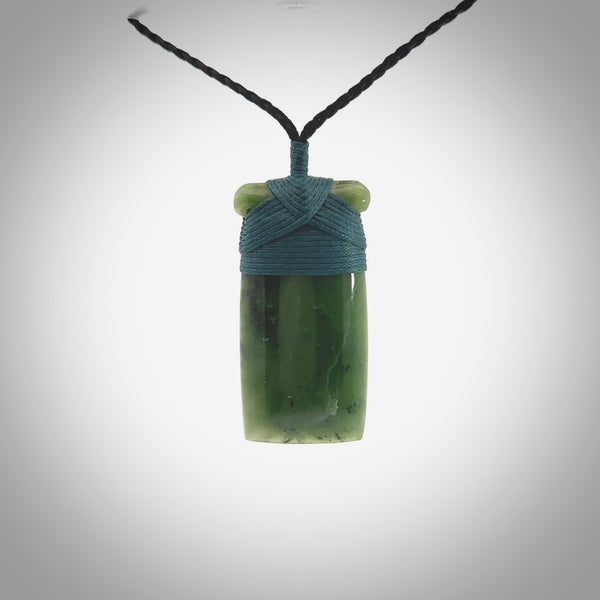 Hand carved jade toki pendant. Carved by NZ Pacific in green jade. Hand made Jade Toki necklace for men and women. Beautiful greenstone Toki with adjustable cord. Delivered to you with Express Courier.