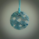 This is a handcrafted aotea stone contemporary disc pendant. This is a wonderful work of art hand made by Ana Krakosky. We ship this worldwide for free and are happy to answer any questions that you may have about these or other products on our website.