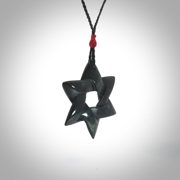Hand carved New Zealand Tangiwai Pounamu Magen David necklace. Unique and creative art to wear from New Zealand Tangiwai Pounamu. Hand made New Zealand Tangiwai star of david pendant. Magen David pendant for men and women.