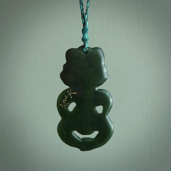 This is a large sized tiki - carved from gorgeous Marsden jade. The craftsmanship is superb, this piece is as well carved as any we have seen. The cord is an adjustable four plaited cord in black. One only by Ana Krakosky.