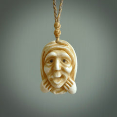 Hand carved incredible stained bone gargoyle face carving. A stunning work of art. This pendant was hand carved in bone with buffalo horn inlay for the eyes by Yuri Terenyi. A one off collectors item that has been hand crafted to be worn or displayed.