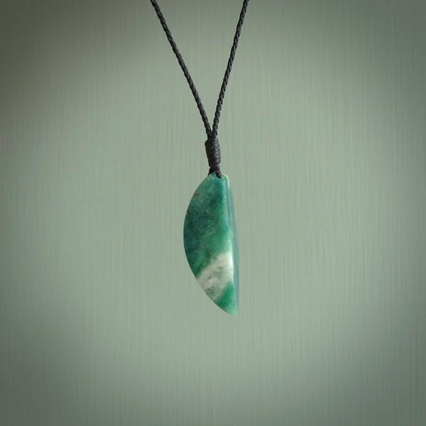This is a handcrafted aotea stone drop pendant. This is a solid little work of art. We ship this worldwide for free and are happy to answer any questions that you may have about these or other products on our website.