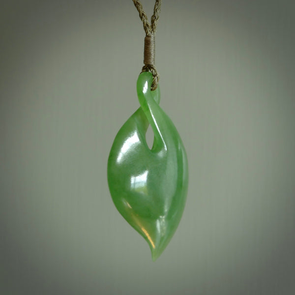 Hand carved New Zealand jade, single twist pendant. Maori pikorua pendant hand carved in New Zealand. Made by NZ Pacific, jade jewellery for sale online. One only hand made by Ross Crump.