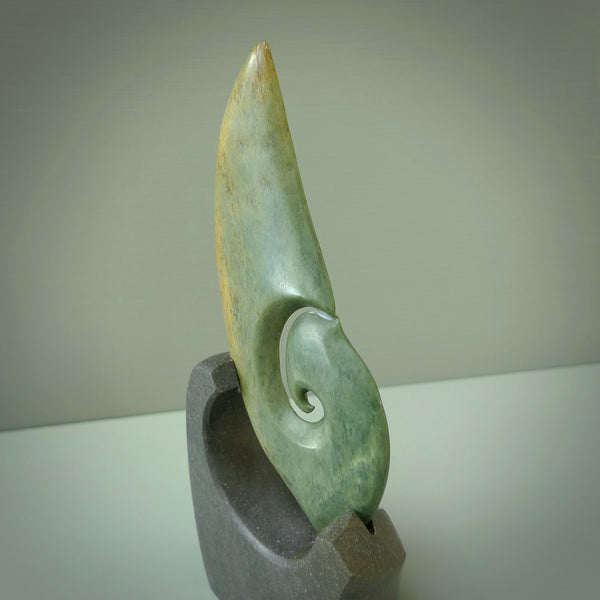 Hand carved New Zealand Flower Jade koru with Greywacke stand sculpture. Hand carved in New Zealand by Ric Moor. This is a one only sculpture and is a beautiful, large, display piece.