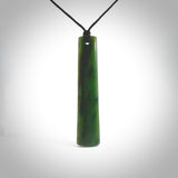 Hand made New Zealand jade Toki drop pendant. Hand carved in New Zealand by Levi Lewis. Hand made jewellery. Unique large Jade drop with fixed length black coloured cord. Free shipping worldwide.