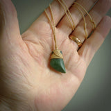 Hand carved jade toki by Ric Moor. Made in New Zealand by NZ Pacific. Hand carved Toki pendants crafted from beautiful New Zealand Pounamu, Jade. We deliver these with Express Courier, on adjustable cords.