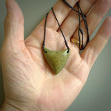 This is a lovely New Zealand Jade, pounamu drop pendant. Hand carved for us by Ric Moor. It is bound with an adjustable black coloured cord which is length adjustable. Free worldwide shipping.