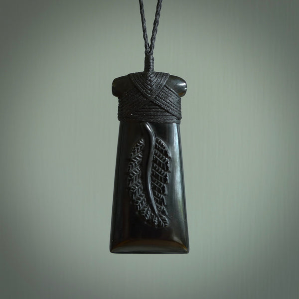 A gorgeous black jade toki pendant, carved with New Zealand's silver fern in relief. This is a pendant we designed for the Rugby World Cup. It is the fern that our national team the All Blacks wear on their jerseys, and the black is the colour of their team uniform. A fantastic and visually striking pendant, designed and carved by NZ Pacific.