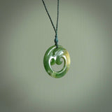 This pendant is a complex koru design. Carved in gorgeous New Zealand jade it is a medium sized pendant that can be worn by anyone. Hand made in New Zealand by NZ Pacific.