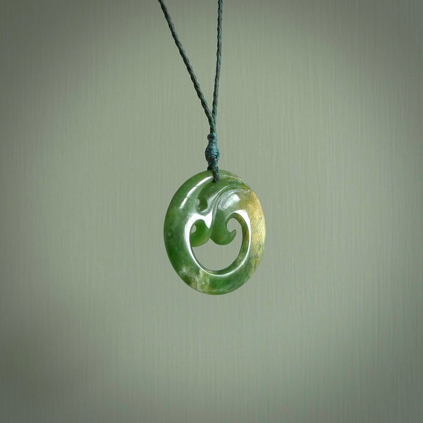 This pendant is a complex koru design. Carved in gorgeous New Zealand jade it is a medium sized pendant that can be worn by anyone. Hand made in New Zealand by NZ Pacific.