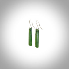 These are stunning medium-large drop shaped jade earrings carved in New Zealand by Darren Hill. It is carved from a semi-translucent light green piece of New Zealand Jade and with Sterling Silver hooks.