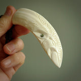 Hand carved engraved boars tusk pendant, carved by us. This particular piece is a contemporary design and is lovingly carved.