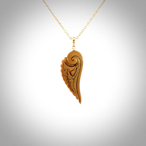 This is a hand carved lotus flower pendant. It is made from woolly mammoth tusk. This is a medium sized necklace and is a very unique, one only, pendant that is a collectors piece. Hand carved by New Zealand artist, Sami.