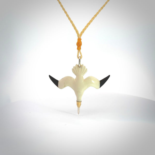 Hand carved stellar intricate Gannet bird carving pendant. A stunning work of art. This Gannet bird pendant was hand carved in Bone. A one off collectors item that has been hand crafted to be worn or displayed.