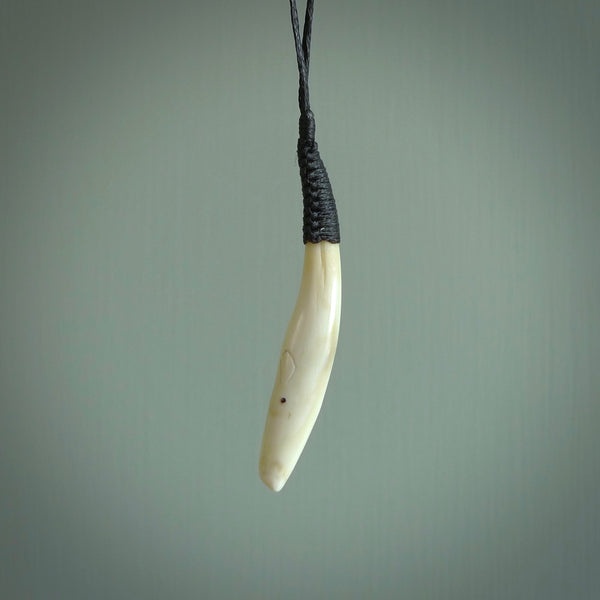 Hand carved sperm whale pendant, carved for us by Fumio Noguchi. This piece is carved from bone and is a fantastic depiction of these giants of the deep. This particular piece is a sperm whale design and is lovingly carved. Free shipping worldwide.
