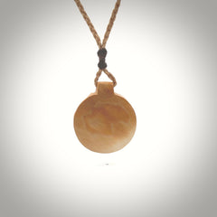 This is a handcarved pendant depicting a beetle on the front face. it is carved from Woolly Mammoth tusk and is a beautiful creamy, golden colour. A lovely and unique necklace for those of us who are fascinated with beetles.