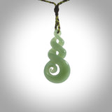 A beautiful carved, complex triple twist pendant. This piece has been carved for us by Ross Crump and is a truly beautiful carving made from some of our finest and rarest flower jade. We will ship this to you with an express courier so you will have it quickly. A rare and beautiful work of wearable art from NZ Pacific.