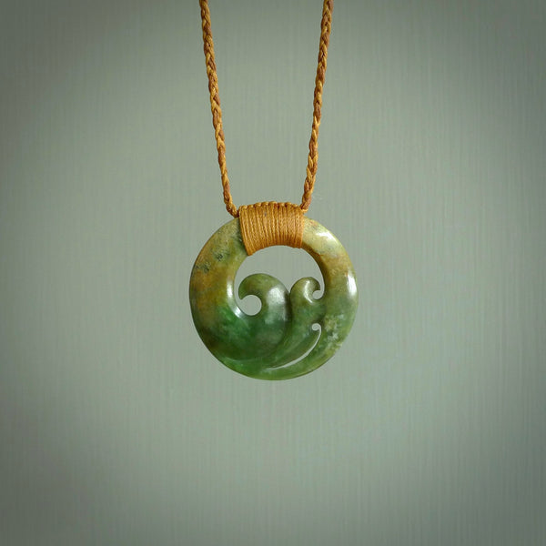 This pendant is a complex koru design. Carved in gorgeous New Zealand jade it is a medium sized pendant that can be worn by anyone. Hand made in New Zealand by NZ Pacific.