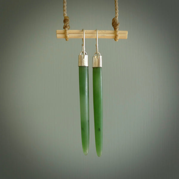 These are stunning large wing shaped drop jade earrings carved in New Zealand by Josey Coyle. It is carved from a deep green piece of New Zealand Jade and with Sterling Silver hooks and findings.