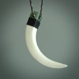 Boars Tusk Pendant with a jade cap. Hand made pendant carved from a boars tusk. Hand made ethnic or maori jewellery for sale by NZ Pacific online.