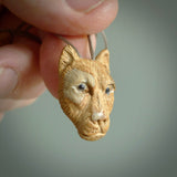 These are small puma cub pendants. They are hand carved from Mammoth tusk and are beautiful. We provide it with a hand plaited cord. Shipping is free worldwide.