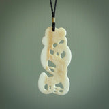 Hand carved bone Tiki pendant. Traditional art hand carved for NZ Pacific. Bone Tiki necklace with Paua Shell eyes.