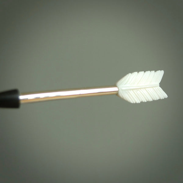 Hand carved arrow made from bone and sterling silver - this is a pendant provided with a sterling silver chain. NZ Pacific pendant for sale online. Hand made archers arrow necklace with sterling silver. One only art to wear.