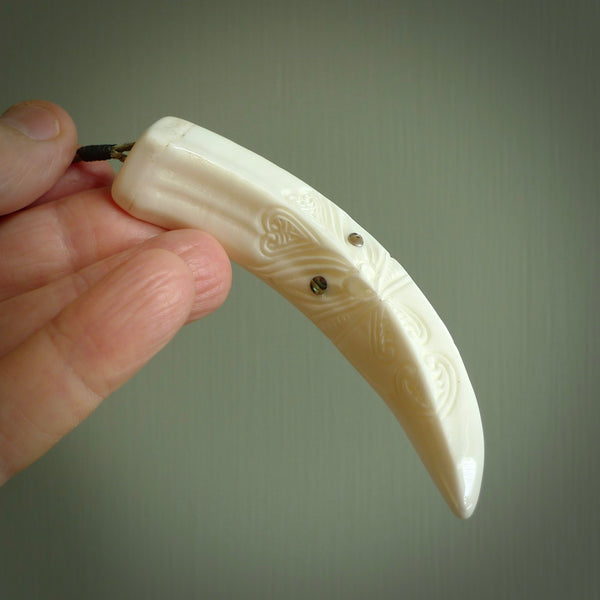 Hand carved Boars tusk pendant. Polynesian carving. South Pacific art. Handmade by NZ Pacific. Unique handmade jewellery for sale online.